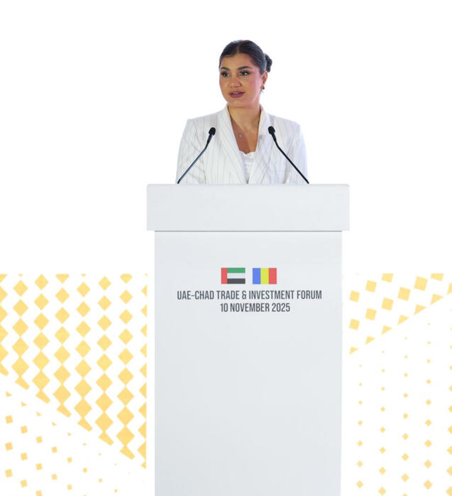 UAE CHAD Trade Forum 2025 alt="MC Dija hosting UAE CHAD Forum 2025" alt="Bilingual emcee on stage for Government Event"