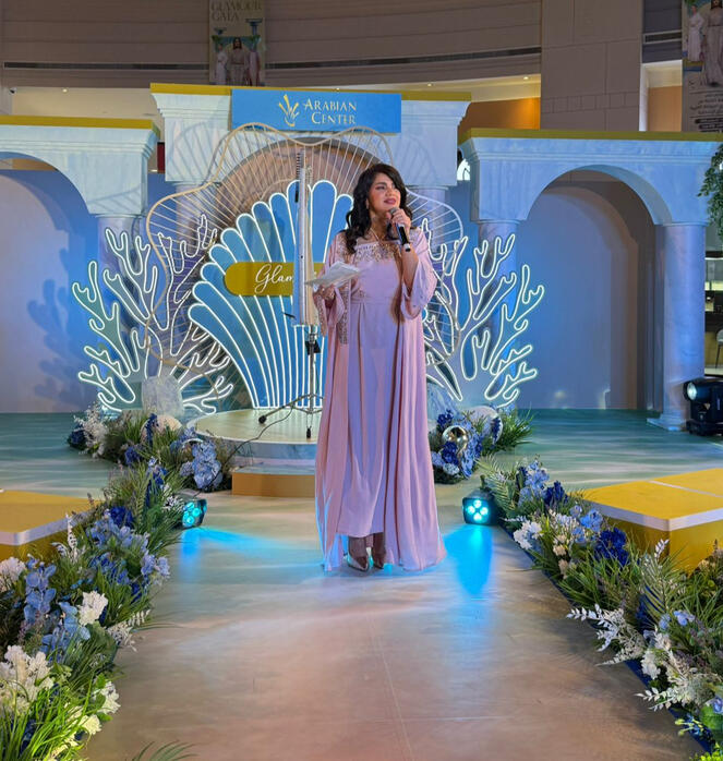 Dija hosting arabian center glamour gala community event alt="MC Dija hosting Community Event - Arabian Center Dubai"
